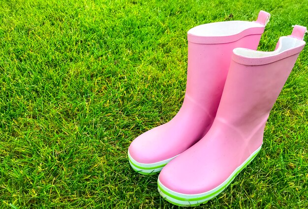 pink and green rain boots