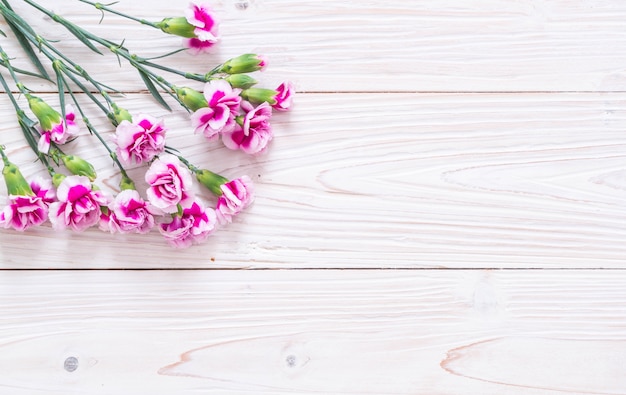 Premium Photo | Pink spring flower on wooden background