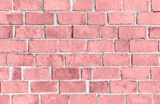 ピンクの質感のレンガの壁の背景 無料の写真