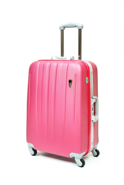 Premium Photo | Pink travel luggage isolated