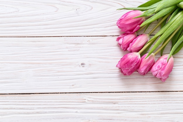 Pink tulip flower on wood background | Premium Photo