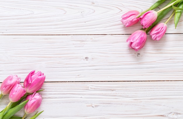 Premium Photo | Pink tulip flower on wood background