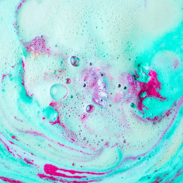 Free Photo | Pink and turquoise blue bath bomb dissolving in water