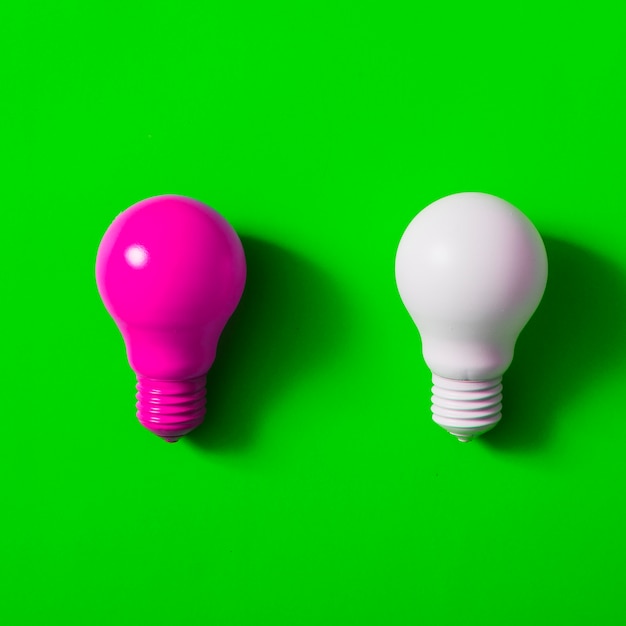 Pink And White Light Bulb On Green Background Free Photo