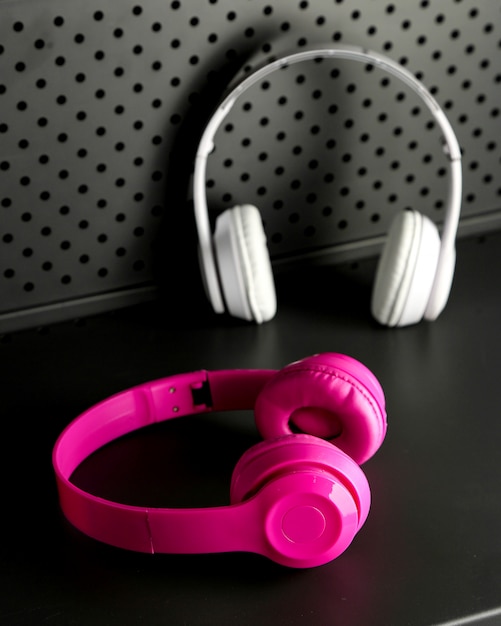 Free Photo | Pink and white wireless headphones