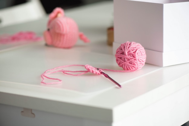 Premium Photo | Pink yarn ball with woolen thread