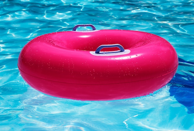 Premium Photo | Pinky swim ring in swimming pool