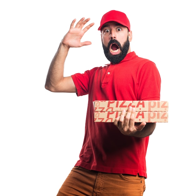 Pizza Delivery Man Doing Surprise Gesture Free Photo