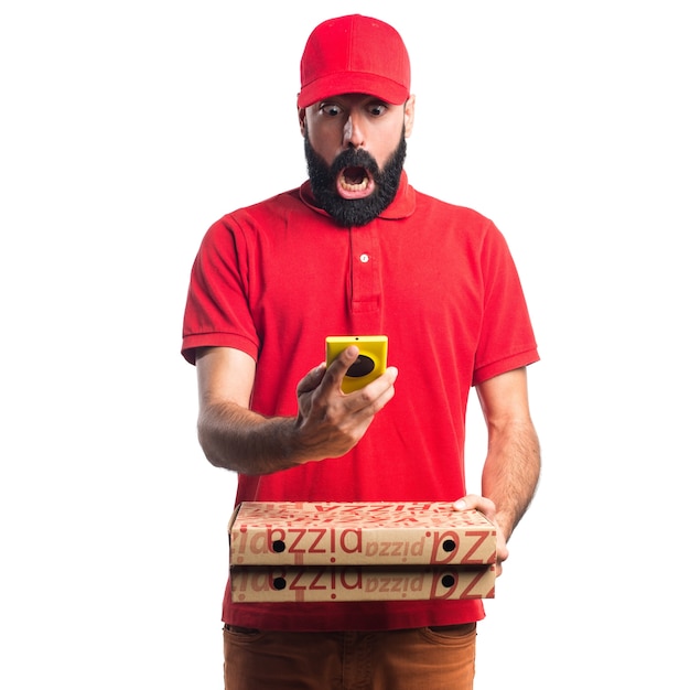 Free Photo Pizza Delivery Man Holding A Mobile.