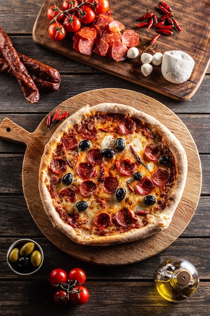 Premium Photo Pizza Diavola Traditional Italian Meal With Spicy Salami Peperoni Chili And Olives