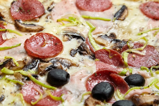 Premium Photo Pizza With White Sauce Cheese Ham Salami Champignons Leek Black Olives And Other Ingredients