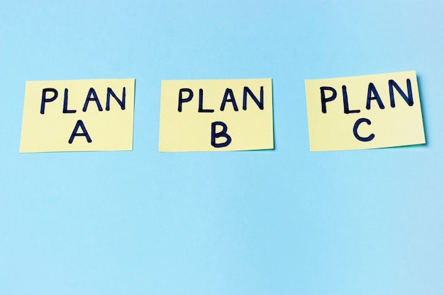 Premium Photo | Plan A, Plan B, Plan C On Multi-colored Office Stickers