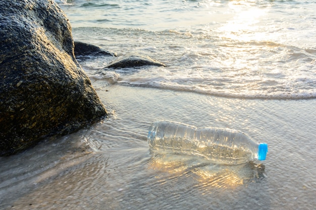 Premium Photo | Plastic bottle on the beach