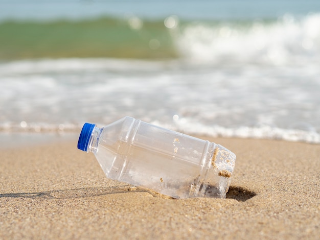 Plastic bottle left on the beach | Free Photo