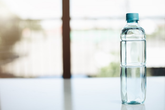 Premium Photo | Plastic bottle with water on the table