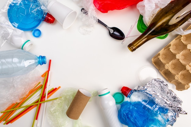 Premium Photo | Plastic trash on a white background. environmental ...