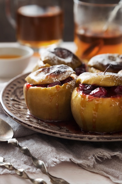 Premium Photo | Plate of baked apples with cranberries