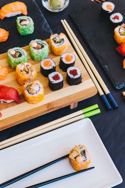 Plate with roll near sushi Photo | Free Download