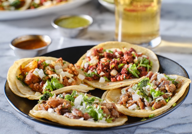 Premium Photo Platter Of Mexican Street Tacos With Carne Asada Chorizo And Al Pastor In Corn Tortillas