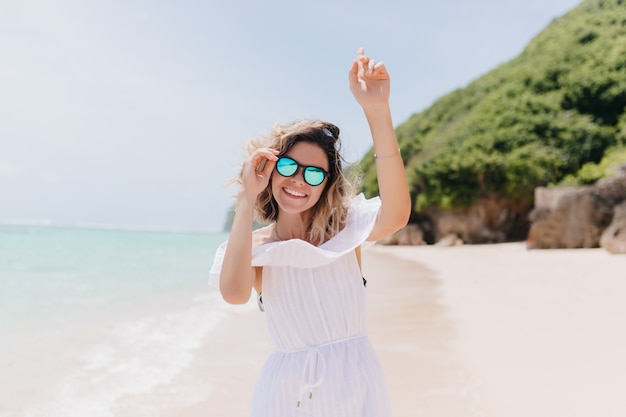 Free Photo | Pleasant young woman dancing at tropical island and ...