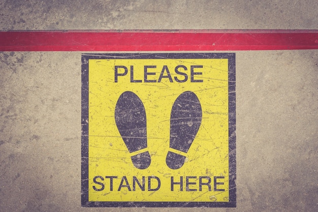 Please stand here foot sign