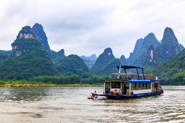 Premium Photo | Pleasure boat on the li river known as lijiang river ...