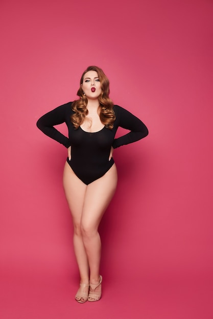 hvid Paradis Illusion Premium Photo | Plus size model woman in black bodysuits posing