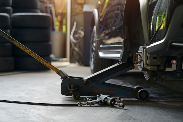 Pneumatic Wrench Tool Car Tire Nuts On The Concrete Floor