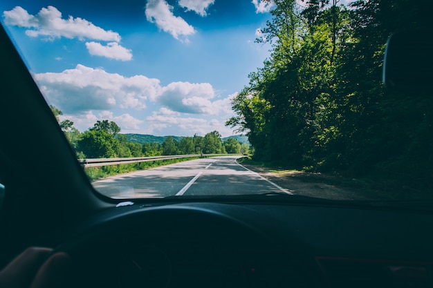 Free Photo | Point of view shot of a person driving a vehicle on the ...