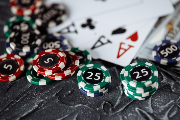 Premium Photo | Poker cards and stacks of poker chips on a grey background.  poker online concept.