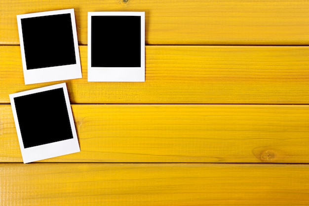 Polaroid Photo Prints On A Wood Desk Or Table Photo Free Download