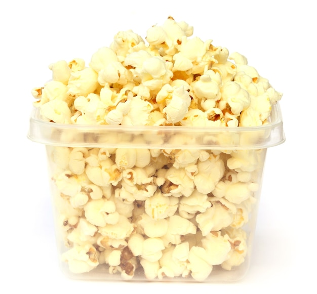 Premium Photo Popcorns on plastic bowl over white background