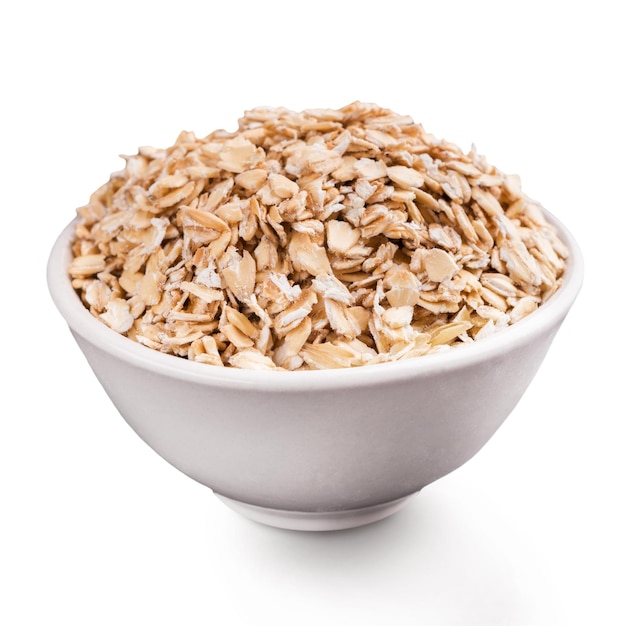 Premium Photo | Portion of raw muesli in white ceramic bowl, isolated ...