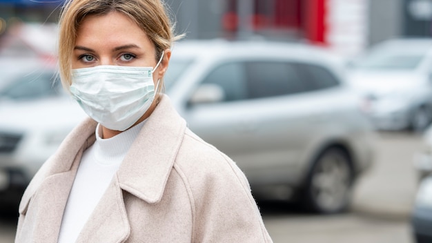 Portrait Of Adult Woman Wearing Surgical Mask Free Photo