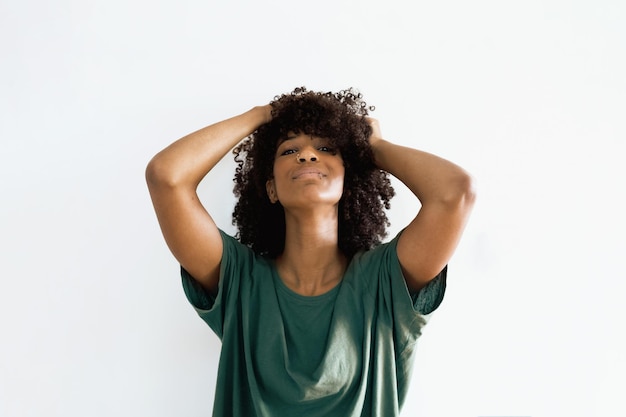 Premium Photo | Portrait of an african descent woman posing against a ...