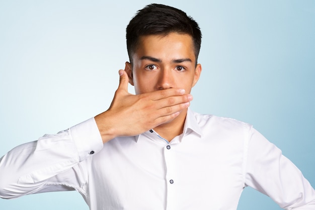 Premium Photo | Portrait of amazed man covering his mouth