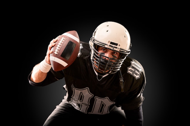 Premium Photo Portrait Of American Football Player With Helmet Close Up On Black Background