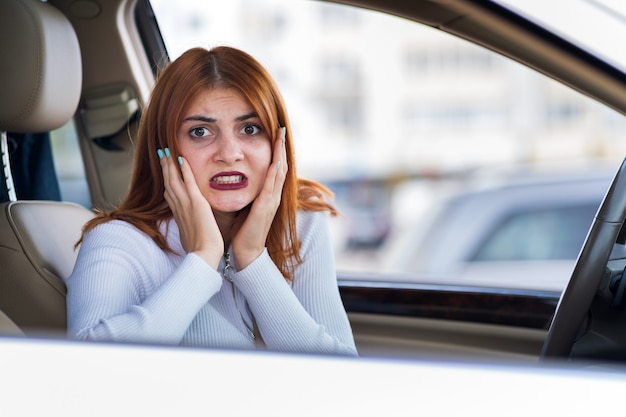 Premium Photo | Portrait of angry woman driving a car