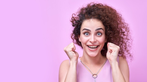 Premium Photo Portrait Of Armenian Positive Curly Haired Girl In Pink