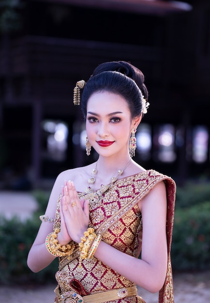 https://image.freepik.com/free-photo/portrait-asian-beautiful-woman-thailand-traditional-costume-standing-outdoor-against-house_35752-671.jpg