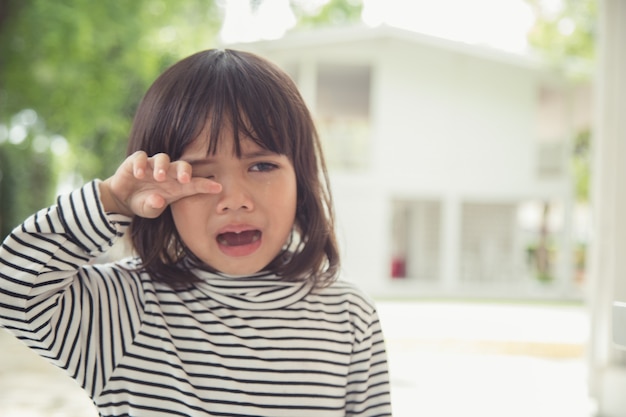 Premium Photo | Portrait of asian crying little girl with little ...