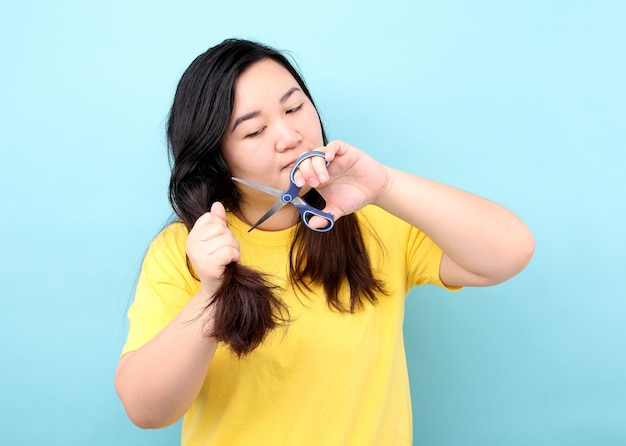 Premium Photo | Portrait asian woman wants to cut her damaged hair,on