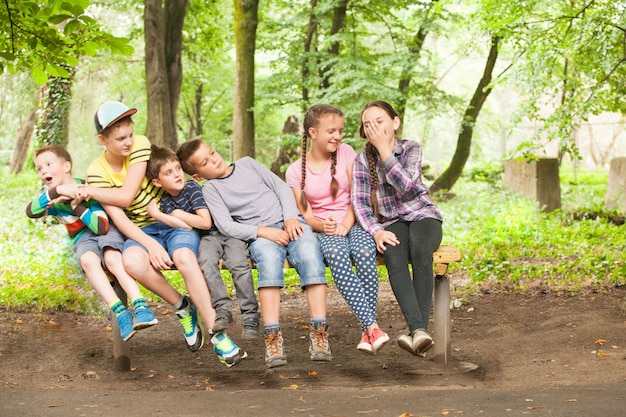 Premium Photo | Portrait of beautiful children sitting together on the ...