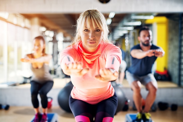 Premium Photo | Portrait of beautiful focused female gym instructor ...