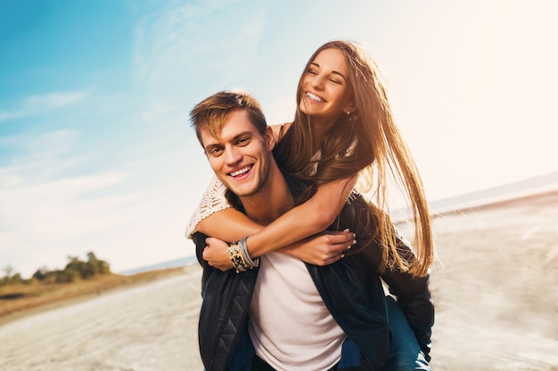 Portrait beautiful healthy young adults girlfriend and boyfriend hugging happy. young pretty couple in love dating on the sunny spring along beach. warm Cute Nickname For boyfriend in Spanish colors. Free Photo
