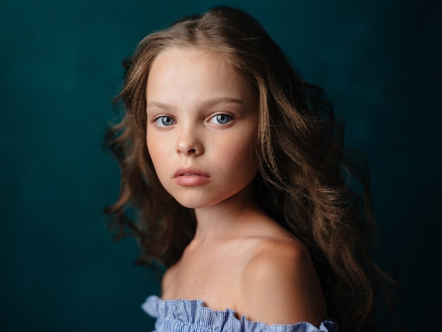 Premium Photo | Portrait of a beautiful little girl in a sundress on a ...