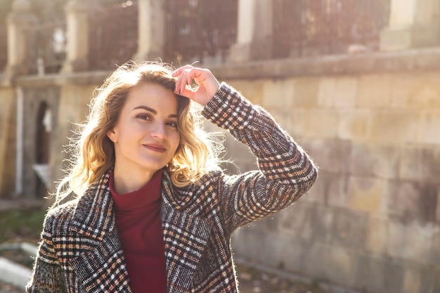 Portrait Of A Beautiful Modern Girl With Blonde Wavy Hair In