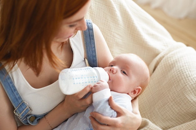 A portrait of beautiful mother with  her baby Free Photo