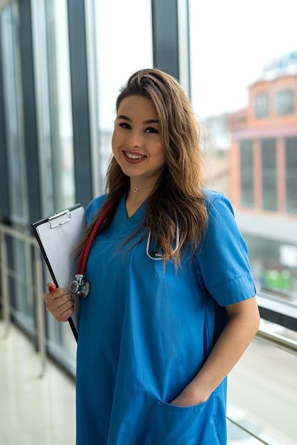 Premium Photo | Portrait Of Beautiful Nurse In Blue Uniform With ...