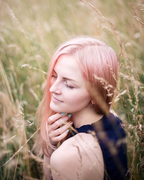 Portrait Of A Beautiful Pink Hair Woman Outdoors In The Park